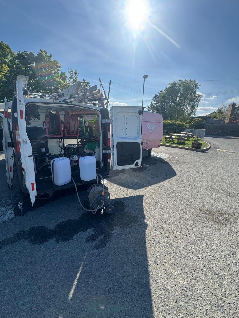 QuickWash NI van with hose reels and water tanks open on a commercial job