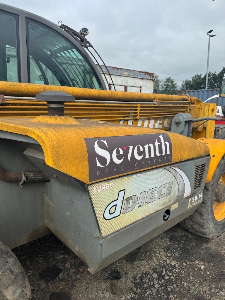 Dirty telehandler bodywork before cleaning